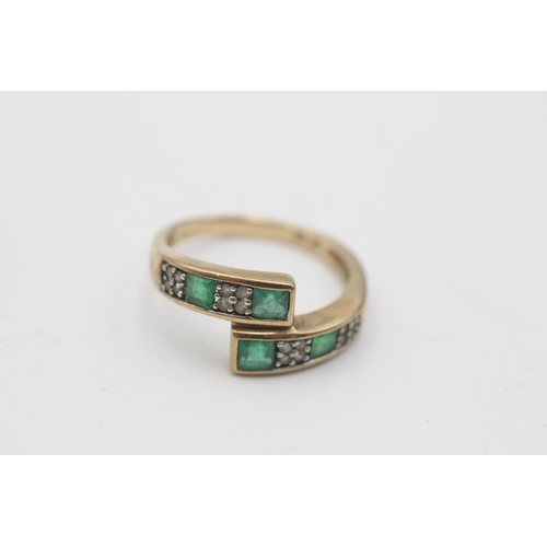 28 - A 9ct gold emerald and diamond channel setting overlap ring, size M½ - approx. gross weight 2.3 gram... 