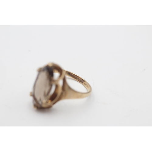29 - A 9ct gold smoky quartz solitaire statement ring, size M½ - approx. gross weight 3.1 grams