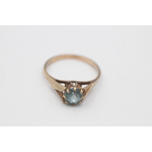 37 - A 9ct gold blue zircon solitaire cathedral setting ring, size N½ - approx. gross weight 1.9 grams