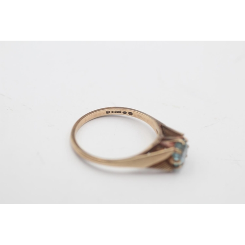 37 - A 9ct gold blue zircon solitaire cathedral setting ring, size N½ - approx. gross weight 1.9 grams