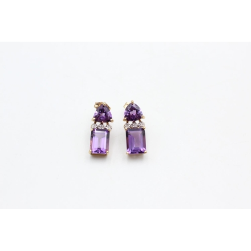 41 - A pair of 9ct gold amethyst and diamond drop earrings - approx. gross weight 2.6 grams