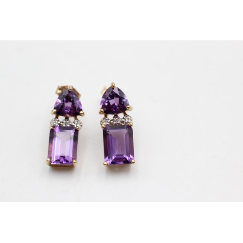 41 - A pair of 9ct gold amethyst and diamond drop earrings - approx. gross weight 2.6 grams