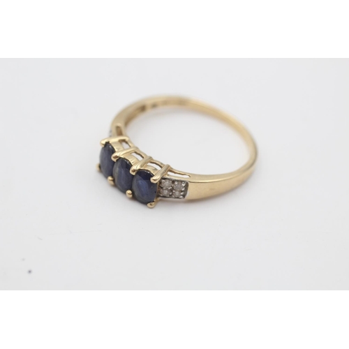 42 - A hallmarked Birmingham 14ct gold sapphire and diamond trilogy and pave setting dress ring, size V½ ... 