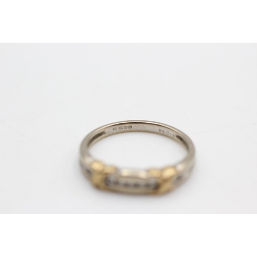 48 - A 9ct gold diamond nine stone channel setting ring, size N - approx. gross weight 2.3 grams
