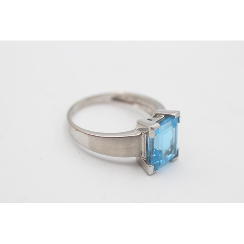 53 - A 9ct white gold blue topaz solitaire cocktail ring, size R - approx. gross weight 4.2 grams