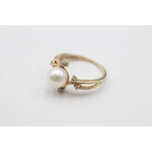 57 - A 9ct gold pearl and diamond seven stone floral crossover setting ring, size K½ - approx. gross weig... 