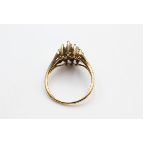 6 - A 9ct gold moonstone eight stone cluster dress ring, size N½ - approx. gross weight 3 grams