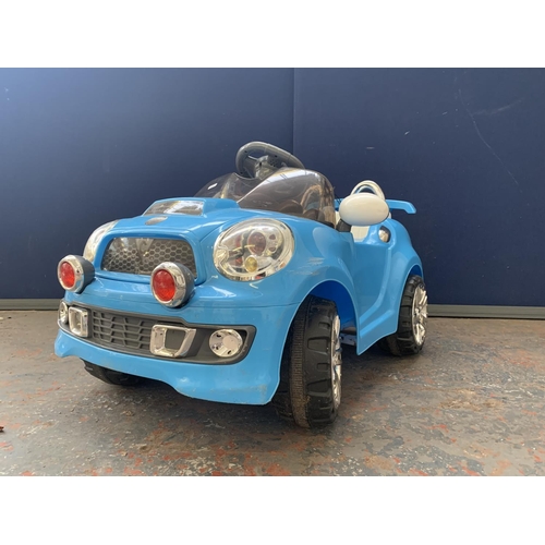 A Mini Cooper S electric toy car with charger Barnebys