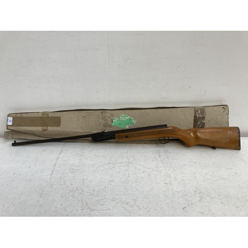 A vintage air rifle with wooden stock and impressed 'Foreign... | Barnebys