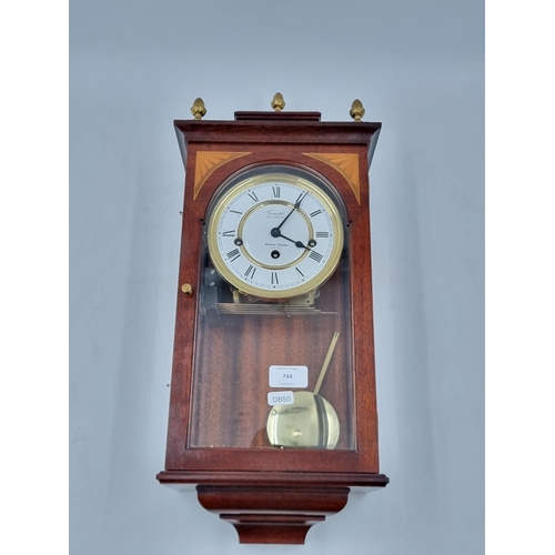 A Comitti of London inlaid mahogany cased wall clock with pe... Barnebys