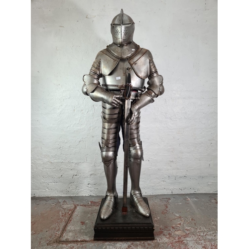 A Medieval style 6ft fully enclosed suit of armour with swor... | Barnebys