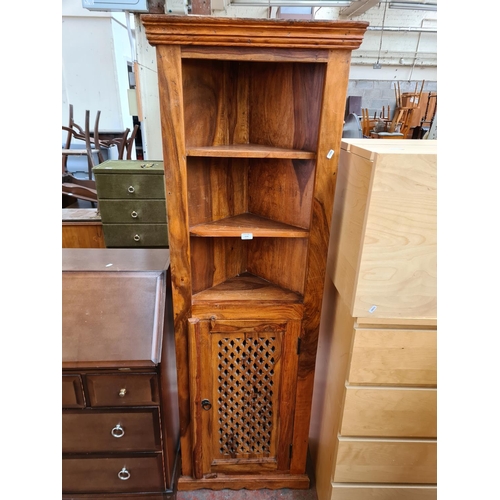 A solid sheesham freestanding corner with three uppe... Barnebys