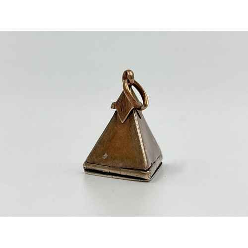 1186 - A stamped 9ct gold & silver Masonic folding pyramid pendant - approx. gross weight 2.89 grams