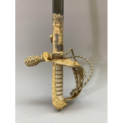 255 - An early 20th century British Royal Navy officers sword with scabbard and belt - sword approx. 98cm ... 