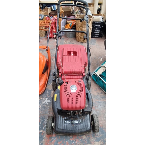 A Mountfield RV40 150cc petrol lawn mower with grass collector