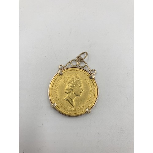 1203 - A 1990 Elizabeth II Australian 100 dollar .9999 gold coin in yellow metal mount, with 3rd portrait o... 