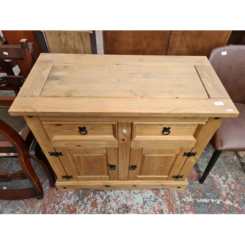 A Mexican pine sideboard with two drawers and two lower cupboard doors