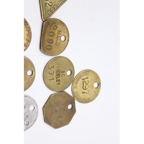 Fifteen vintage brass miners and colliery pit check tags