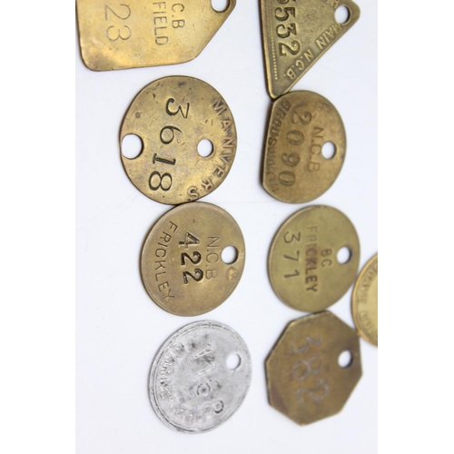 Fifteen vintage brass miners and colliery pit check tags