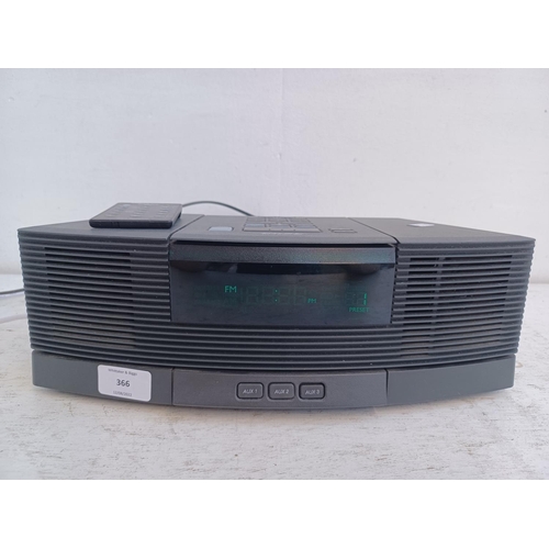 A Bose AWRC3G Wave radio/CD player with AWACPR pedestal and remote control