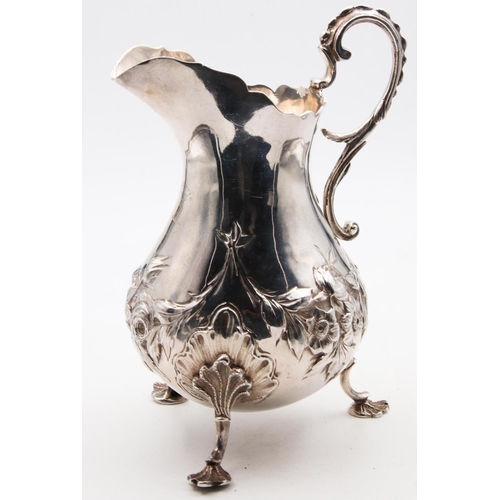 45 - Antique Silver Shaped Form Milk Jug with Flying C Scrolled Handles above Shaped Supports Approximate... 