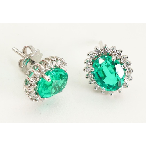 606 - Pair of Emerald and Diamond Ladies Earrings Mounted on 18 Carat Gold