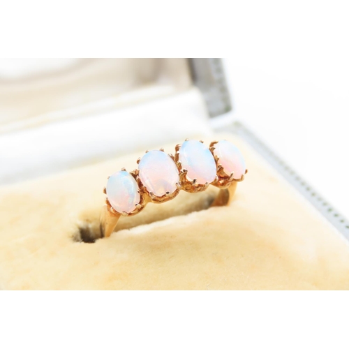 16 - Opal Four Stone Ladies Ring Cabochon Cut Mounted on 15 Carat Yellow Gold Band Ring Size J