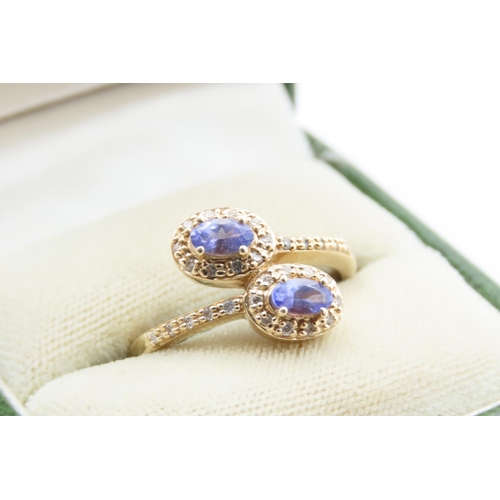 23 - Twin Stone Tanzanite and Diamond Crossover Ring Set on 14 Carat Yellow Gold Band Ring Size Q