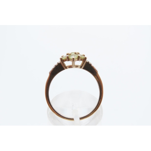 44 - Peridot and Diamond Ladies Cluster Ring Mounted on 9 Carat Yellow Gold Band Ring Size N