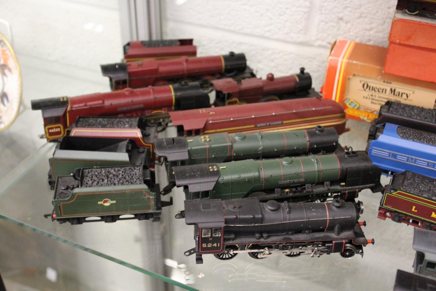 A collection of Hornby double OO gauge trains and carriages.