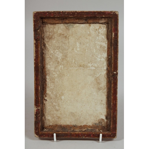 A 19TH CENTURY PERSIAN QAJAR LACQUERED PAPIERMACHE MIRROR FRAME, 21.5cm x 14cm.