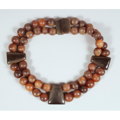 AN ANTIQUE RHINO HORN BEADED NECKLACE.**Please note: this item can only ...