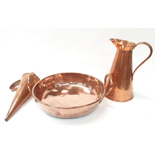119 - Twin handled copper tray together with a copper jug and measure.