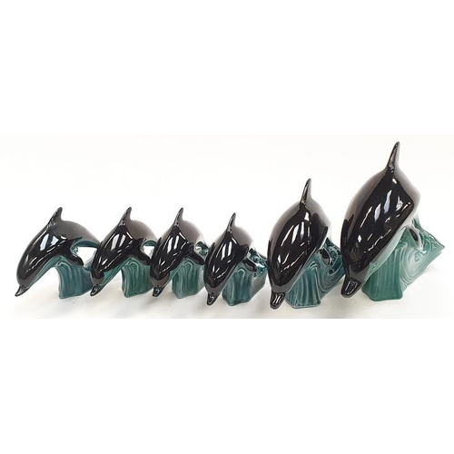 151 - Collection of six Poole Pottery Dolphins.