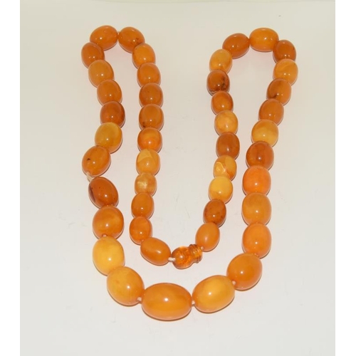 206 - A Strand of Vintage Baltic Butterscotch Yellow Amber Beads. Weight 72g. Beads 15mm - 22mm.