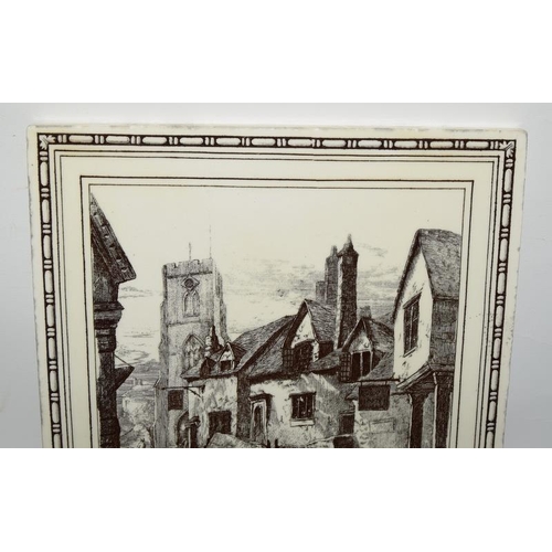 127 - Mintons three large tiles L. T. Swetnam depicting landscapes, Conway Castle, Townscape with Church, ... 