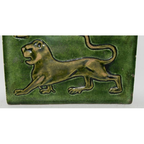 346 - William De Morgan & Co, Sands End Pottery, Fulham earthernware tile with green glaze depicting a 