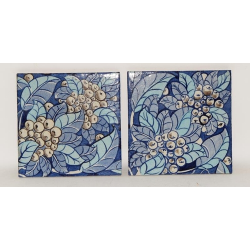 347 - William De Morgan pair of matching tiles depicting foliage & berries in shades of blue, marked DM 98... 