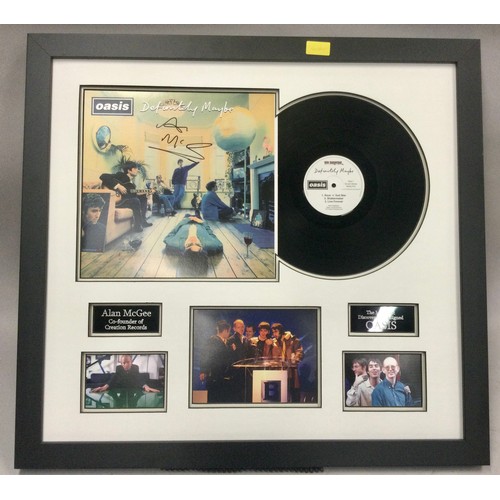 345 - SIGNED OASIS FRAMED ALBUM COVER. Not by Oasis but by the owner of Creation Records ‘Alan McGee’ who ... 