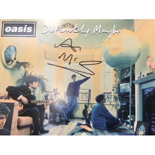 1176 - SIGNED OASIS FRAMED ALBUM COVER. Not by Oasis but by the owner of Creation Records ‘Alan McGee’ who ... 