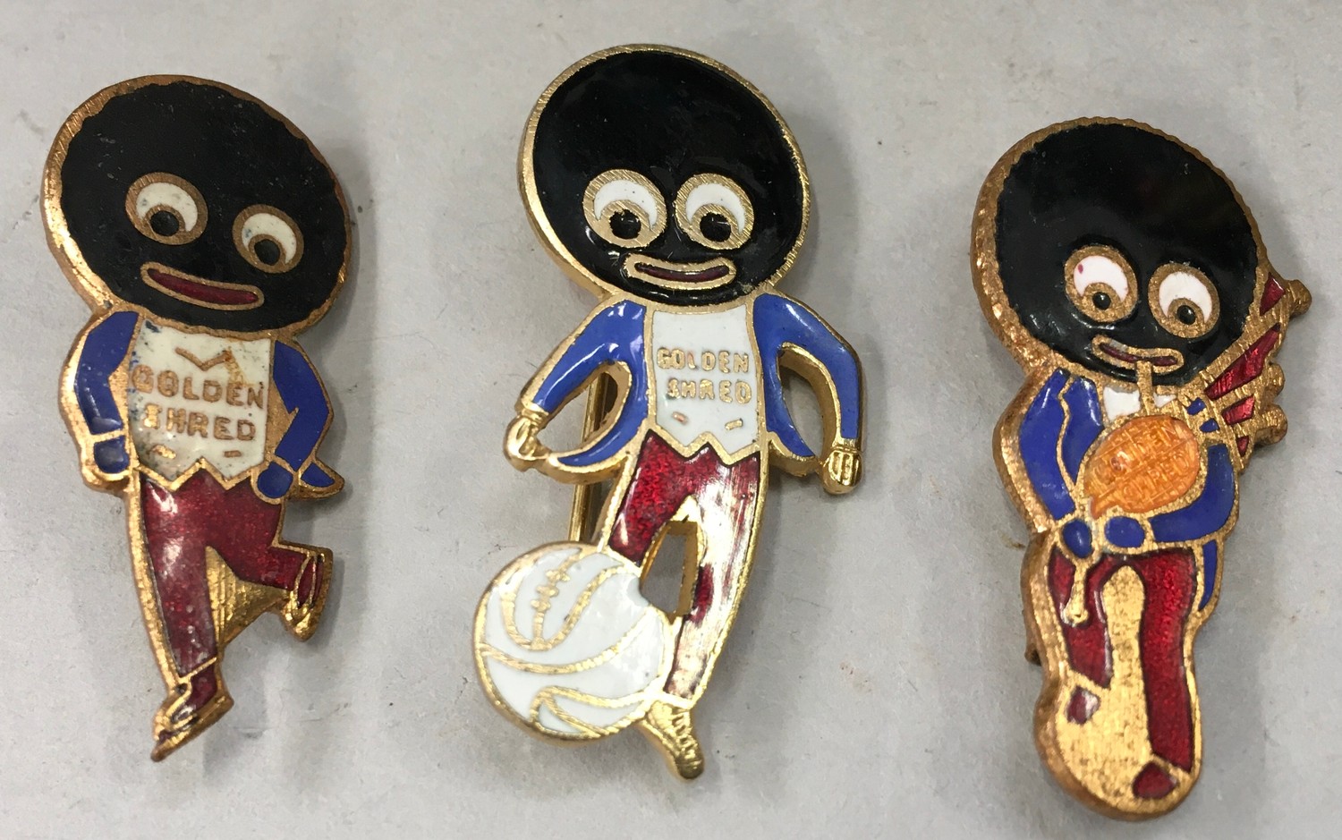 The Golly Robinson band together 3 vintage enamel lapel badges. (These