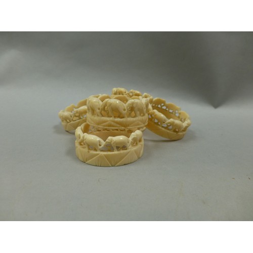17 - Small collection of carved ivory items including set of 6 elephant napkin rings
