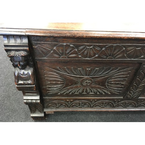 179 - An antique oak intricatley carved wood coffer 106x45x55cm.