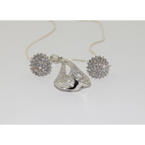 57 - Quantity of 925 gem set pendant and earrings
