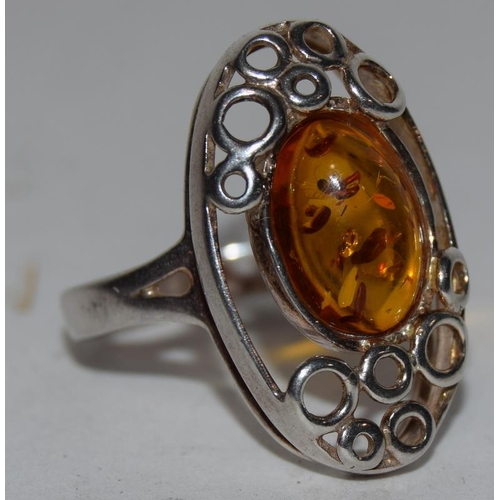 72 - A large silver 925 and amber ring. Size R