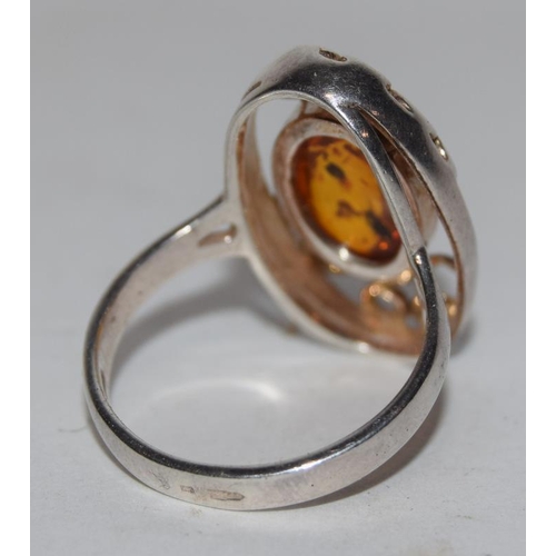 72 - A large silver 925 and amber ring. Size R