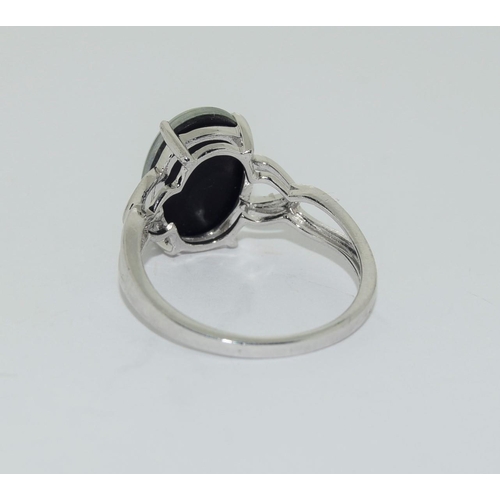 133 - Silver ladies ring set with a glassed marble finish. Size R.