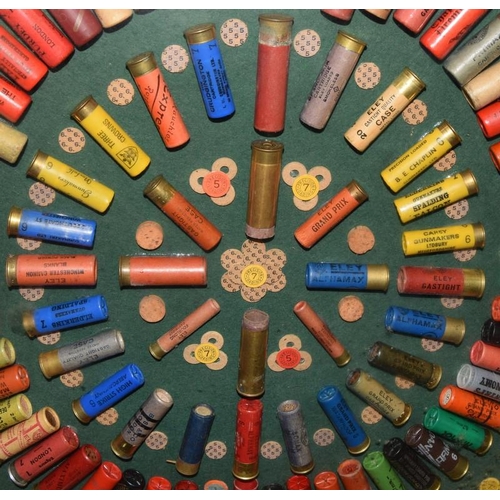 53 - Glazed and framed display of shotgun cartridges from 1927-1987. Around 80 cartridges displayed in al... 