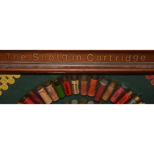 53 - Glazed and framed display of shotgun cartridges from 1927-1987. Around 80 cartridges displayed in al... 