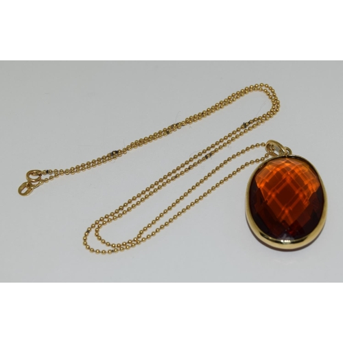 49 - Gold amber quartz pendant necklace.